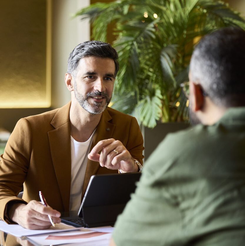 male attorney meeting a male client, discussing his divorce